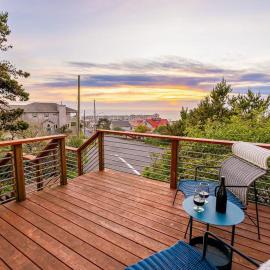 Family-friendly home with ocean views with ping pong foosball fireplace deck