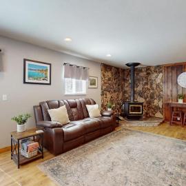 Conveniently located with large deck & fireplace - all the comforts of home