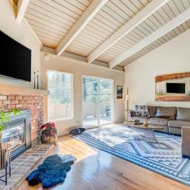 Two-story mountain-view condo with balcony fireplace & pool - dog-friendly
