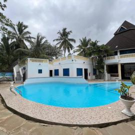 Luxurious 4-Bedroom Holiday House with Pool Access in Diani Beach
