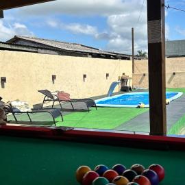 Casa com piscina aquecida e quadra de vôlei, hotel din Osório