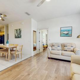 Cozy coastal condo with shared pool full kitchen & close to beach