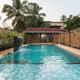 Modern 1BHK in Candolim with Pool & Gym near the Beach by HIREAVILLA