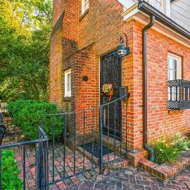 Charming brick home with patio, WiFi, AC, & WD - walk to everything