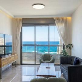 Bright 3BR w Large Terrace & Sea View l Mamad, hotel in Bat Yam