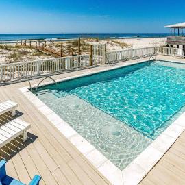 Completely renovated oceanfront home with shared outdoor pool views & balcony, hotel in Fort Morgan