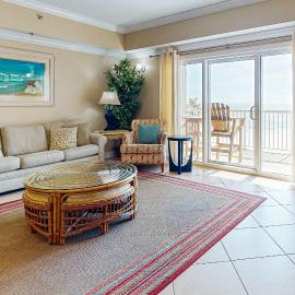 Spacious condo with Gulf-front views & access to pools hot tub gym