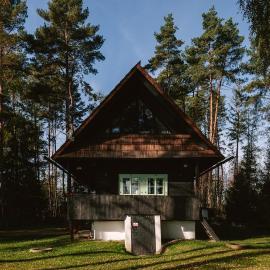 Cozy wooden cottage by the lake with a sauna