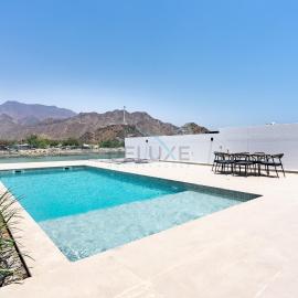 Well-Appointed 4BR Villa with Assistant Room and Private Pool, Featuring Sweeping Views of the Mountains and Sea, Minutes from Fujairah Pristine Beach, Al Dana Island, Fujairah by Deluxe Holiday Homes