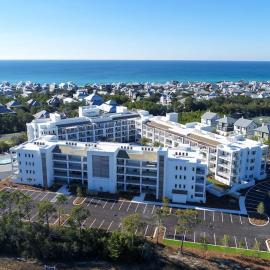 Modern condo with pool hot tub gym wrap-around balcony & AC