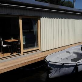 B&Boathouse Amsterdam with bikes and motorboat