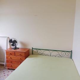 Large bedroom in a private host house with shared bathroom, garden, veranda, and free private parking, hotel in Bouillante