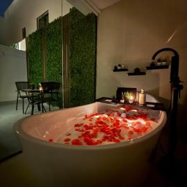 Cozy Escape Bathtub Patio Seating 65 inch TV