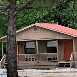 Modern Cabin with Gorgeous Wood Paneled Walls Nestled in the Scenic Beauty of the Ozarks