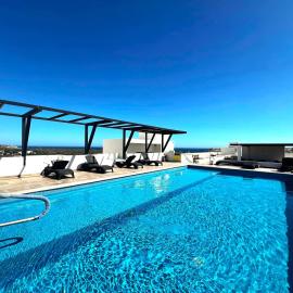 Bahia del Tezal 103b Modern 1BR Retreat with Rooftop Pool & Beach Access