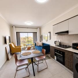 Cozy airport stay with gym and workspace