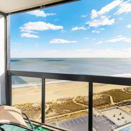 Bright & convenient condo with pool balcony & angled ocean views