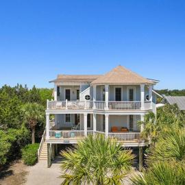 Elegant Beachfront Escape with Wrap-Around Porches