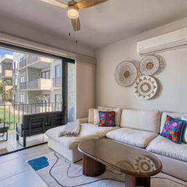 Bright and Modern Condo w/ Balcony, Shared Pool, A/C, minutes to Beach & Town