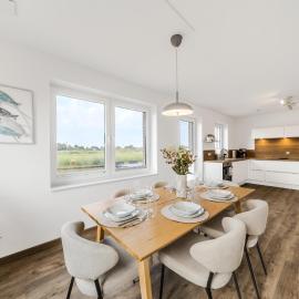 Küsten Suite Haus Grachtenwinkel direkte Wasserlage, 2 Terrassen, 106qm, Neubaugebiet – hotel w mieście Greetsiel