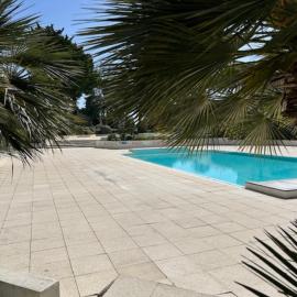 Apartment with pools and garden near the beach