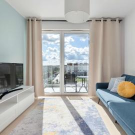 Comfortable Apartment with Balcony Workspace and Underground Parking by Noclegi Renters