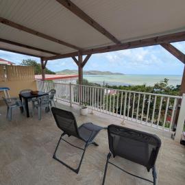 1 to 3 bedrooms upstairs in a villa with sea view, hotel in La Trinité