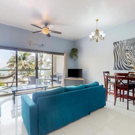 Beachfront condo with balcony sea view partial AC pool dock & kayaks