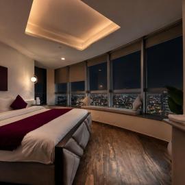 Whispers above the city 2Bhk Centaurus Mall pool Gym City view