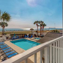 Beachfront 2nd floor condo with private balcony shared pool and hot tub BBQ