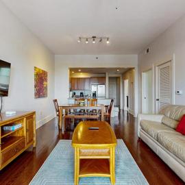 Polished condo with balcony & pools - one block from the beach