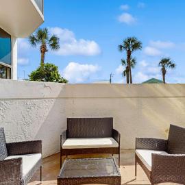 Cozy ground-floor condo with private patio shared pool & beach access