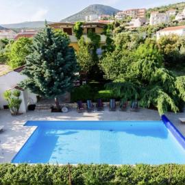 Apartments Robi with shared heated pool & balcony, near the beach