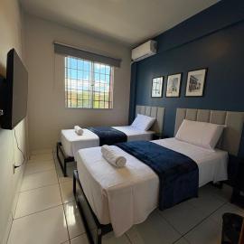 Quarto com Ar Condicionado e banheiro no centro