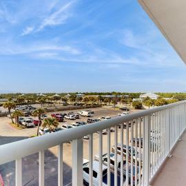 Elegant beachfront condo with wraparound balcony Gulf views & pools