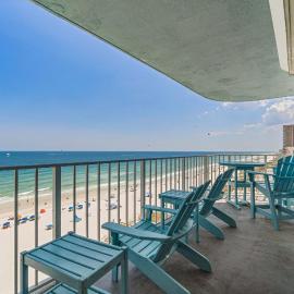 Stunning beachfront condo with a full kitchen private balcony & shared pools
