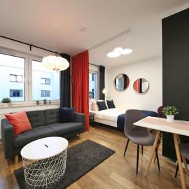 A very cozy apartment with a large bed