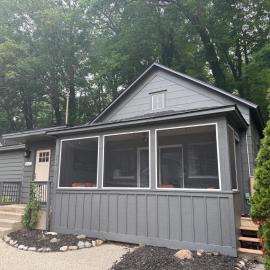 Screened porch pt water views hot tub walk to Saug