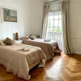 With a balcony overlooking the Obelisco, between Jacarandas and Tango