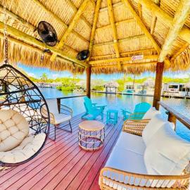Waterfront Tiki Getaway with Private Boat Dock
