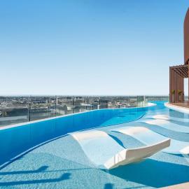 Rooftop Infinity Pool plus Heated Pool, Gym, Free Parking & more