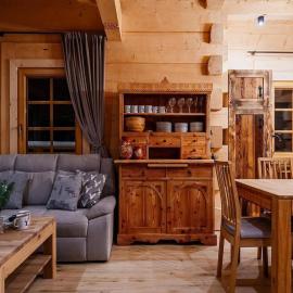 A large mountain-style house with a spa area