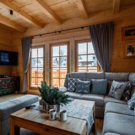 A large mountain-style house with a spa area
