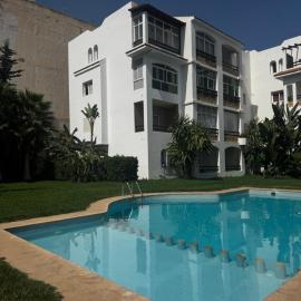 Charming Apartment with Balcony, Pool, Parking, and 2700m2 Garden