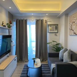 A minimalist and spacious 1Br condo at Amani Grand Resort Residences Mactan near MCIA
