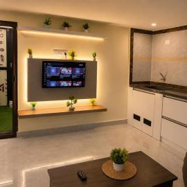AC Private 1BHK with Movie Lounge and Fast WiFi
