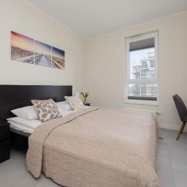 Comfortable Apartment with Air Conditioning and a Family Parking Space by Noclegi Renters