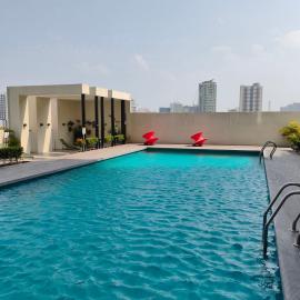 Modern Studio Near IT Park with Pool & Fast WiFi - The Median