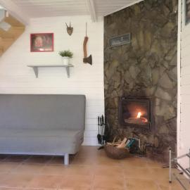 Holiday home with a fireplace and a large terrace