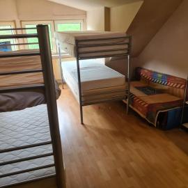 bed in little room, hotel in Essen